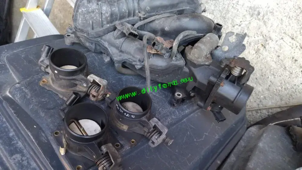 škrtící klapka Mondeo 01- 1.8i 92kW